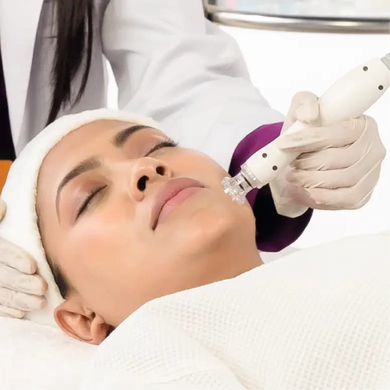 Esthetician performing a DiamondGlow hydrating facial treatment