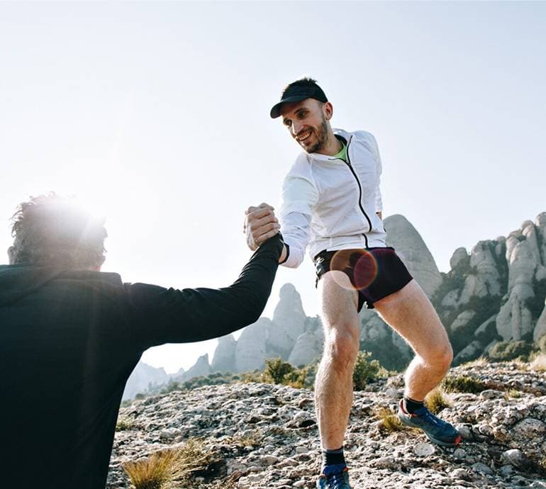 A man being active outdoors in the mountains