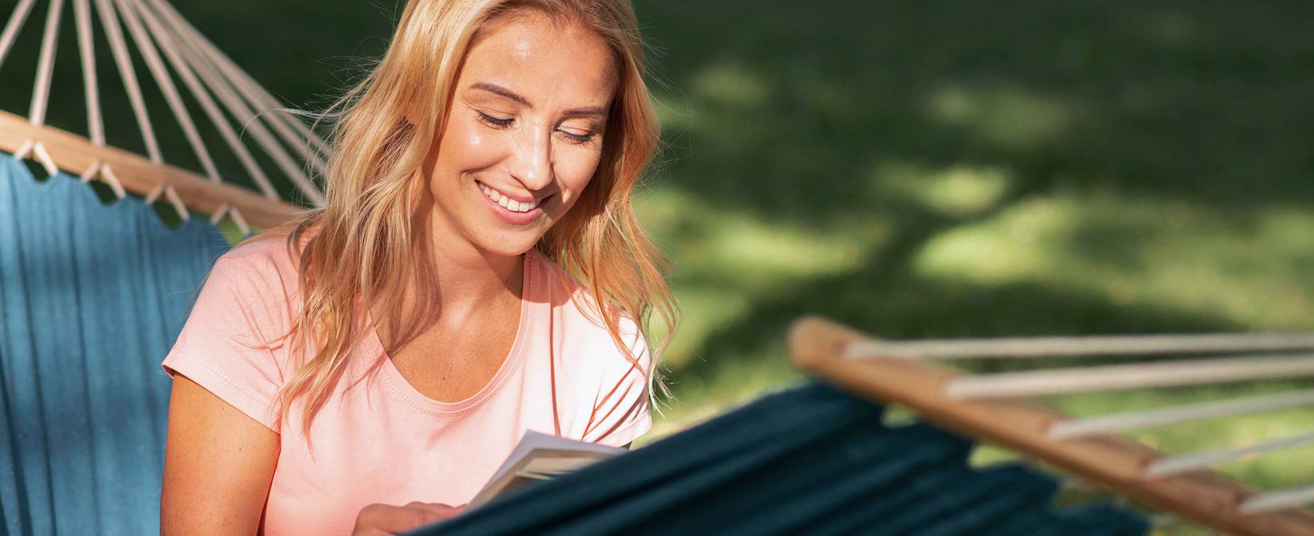 A woman resting outdoors, representing restored energy and balance