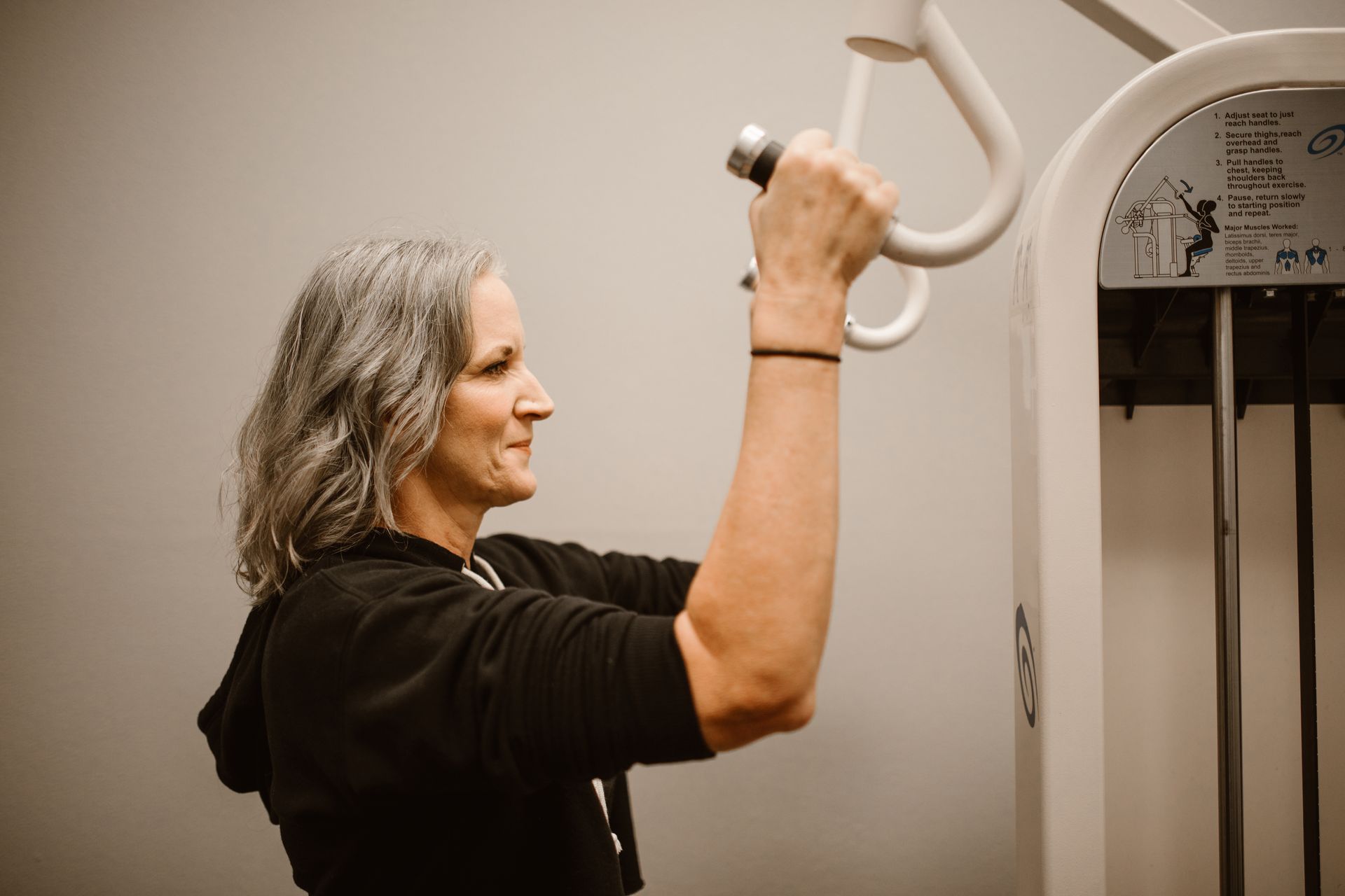 An active mature woman, strength training