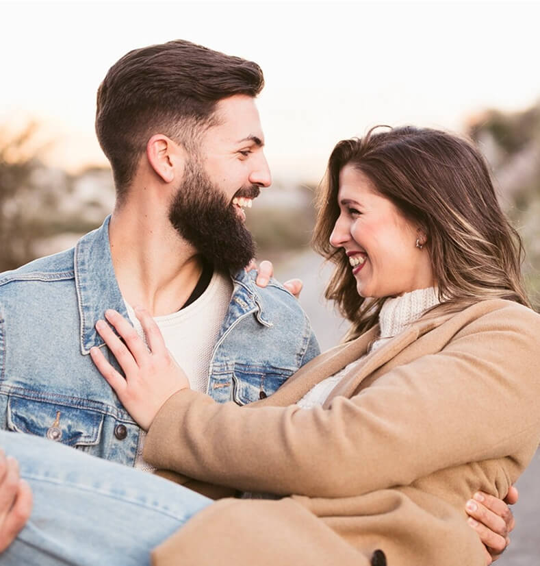 A happy couple enjoying time together outdoors